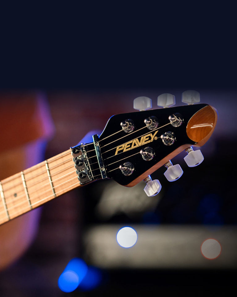 Peavey electric guitar headstock close-up with locking nut