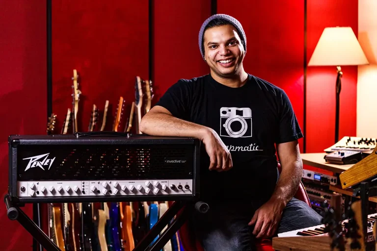Misha Mansoor from Periphery leaning on his Peavey invective.120 Guitar Amp Head